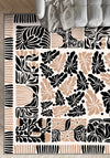 Black, beige, and white patterned rug