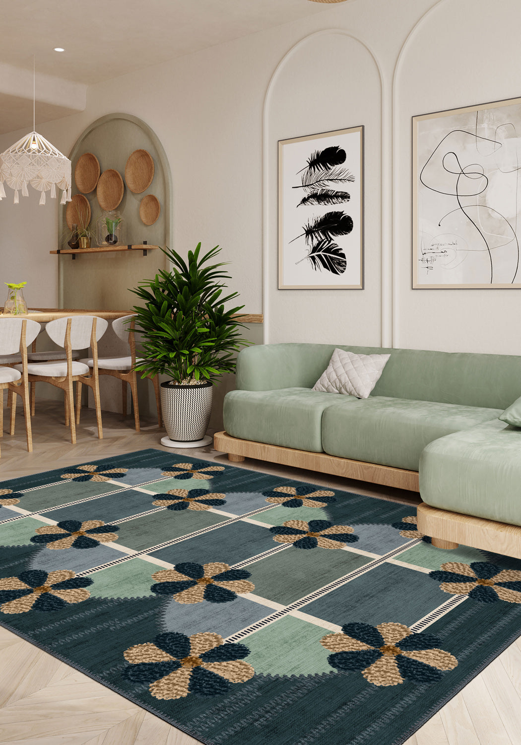 Living room with a green sofa, patterned rug, and decorative wall art.