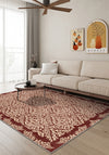 Living room with a beige sofa, patterned rug, and wall art.