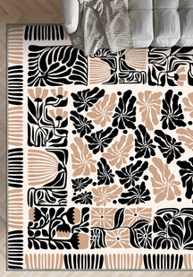 Black, beige, and white patterned rug