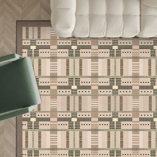 Beige geometric rug on a wooden floor